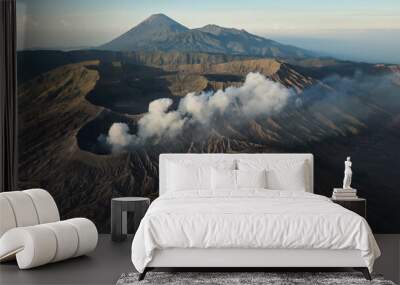 Drone view of Mount Gunung Bromo volcano in East Java, Indonesia. Mount Bromo is active volcano in clouds of smoke with crater in depth Wall mural