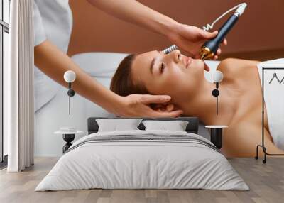 Face skin care. Ultrasound cavitation face treatment in medical Wall mural