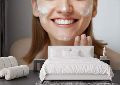 Face skin care. Woman cleaning facial skin with foam soap Wall mural