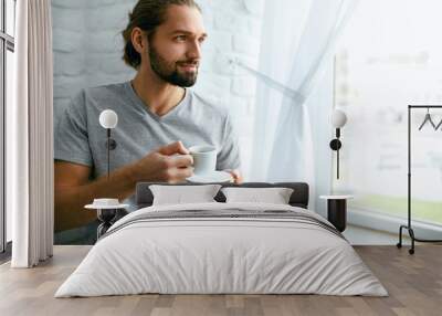 Man Drinking Coffee At Home In Morning. Wall mural