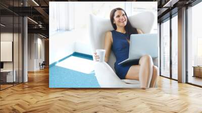 Portrait of relaxed business woman in office. Relax and freedom Wall mural