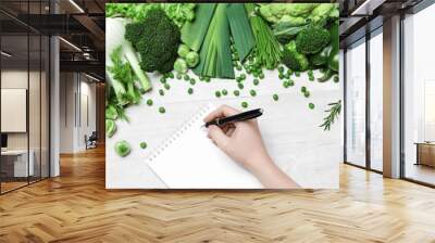 Shopping List. Hand Writing In Notebook Near Vegetables Wall mural