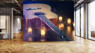 Acoustic guitar on a black background with candles. Wall mural