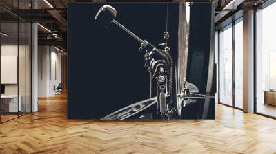 Bass drum with pedal, musical instrument on black background. Wall mural