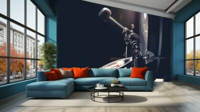 Bass drum with pedal, musical instrument on black background. Wall mural