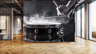 man plays musical percussion instrument with sticks, a musical concept, beautiful lighting on the st Wall mural