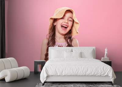 Portrait of a little cheerful girl with ice cream on a colored background Wall mural