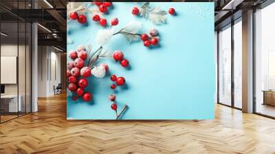 Red winter berries on a blue background, generative AI. Wall mural