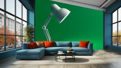 White table lamp on a green background, copy space. Wall mural