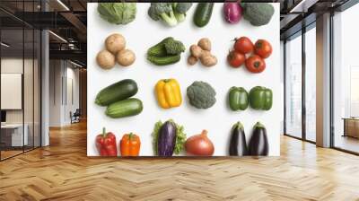 A variety of fresh vegetables, including broccoli, zucchini, bell peppers, tomatoes, eggplant, onions, and potatoes, arranged in a grid on a white background. Wall mural