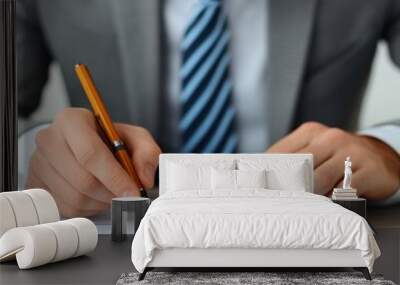 Close-up of businessman's hand analyzing a graph. Wall mural