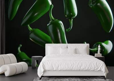 Green jalapeno peppers falling against a black background. Wall mural