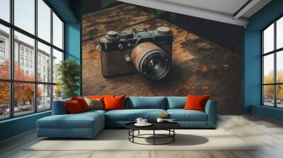 Old film camera on wooden table. Wall mural