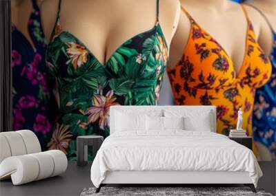 Three mannequins displaying floral print swimsuits. Wall mural