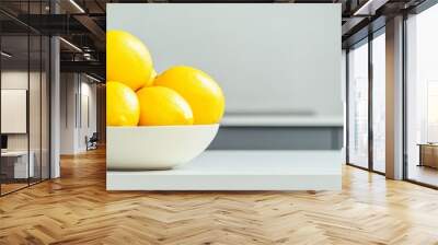 Vibrant Yellow Fruit Display in Modern Minimalist Kitchen for a Fresh and Healthy Monday Morning Start Wall mural