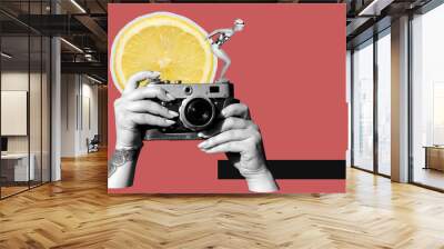 Digital collage with female hands holding vintage film camera, woman in swim suit and slice of a lemon	 Wall mural