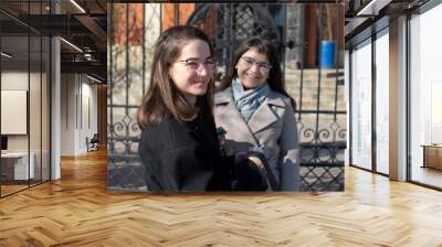 Portrait of a two young women in eyeglasses Wall mural