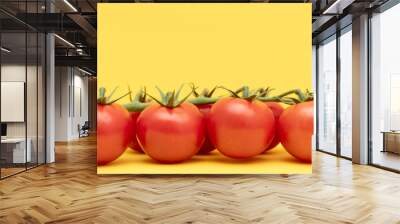 Red cherry tomatoes with green branch on yellow background	 Wall mural