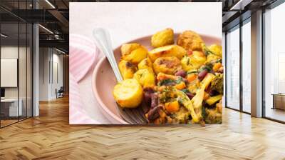 Stewed potatoes with stewed vegetables, broccoli and beans with carrots and herbs, a delicious hearty lunch or dinner Wall mural