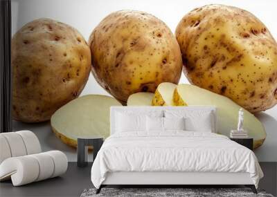 3 whole potatoes and slices set on white Wall mural