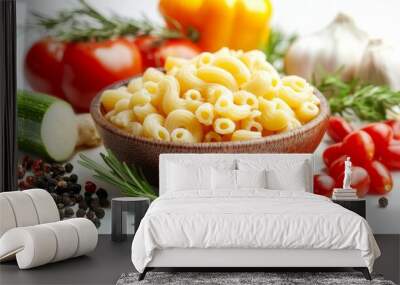 Shell macaroni with herbs, spices, and vegetables on a white background, for a healthy pasta dish. Wall mural