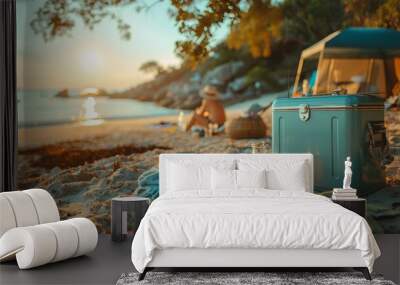 Serene beach camping scene at sunset with a cooler and tent in view, evoking a tranquil and relaxed atmosphere on a wonderful beach getaway. Wall mural