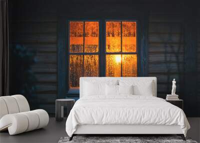 Warm glow from a window at night. Wall mural