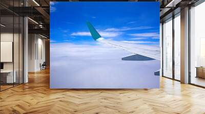 Airplane wing with beautiful blue sky Wall mural