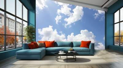 Fluffy white clouds in a blue sky on a sunny day, fluffy, day Wall mural