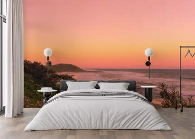 The Pinky sunset in summer time on the beach in Ballina with ocean view and hilly landscape, Byron bay, Australia Wall mural