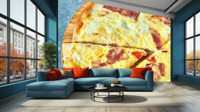 Slice of hot pizza large cheese lunch or dinner crust seafood meat topping sauce. with bell pepper vegetables delicious tasty fast food italian traditional on wooden board table classic in view Wall mural