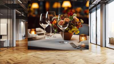 Romantic dinner table setting awaits guests in the restaurant Wall mural