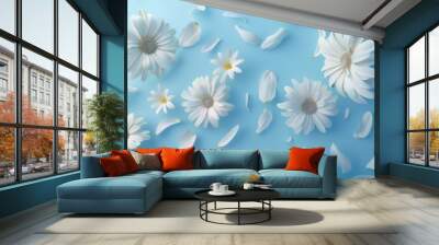 Floral frame background of Plain light blue paper structure background with blank copy space in the middle, on top of the background are smller and bigger daisy blossoms scatterd arround Wall mural