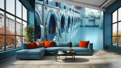 A row of washing machines in a laundromat, showcasing a clean and organized space. Wall mural