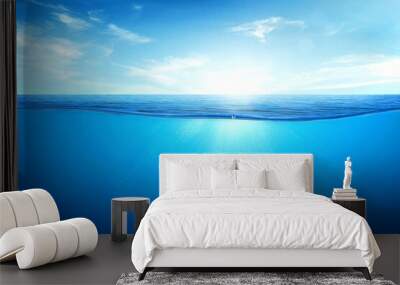 BLUE UNDER WATER waves and bubbles. Beautiful white clouds on blue sky over calm sea with sunlight reflection, Tranquil sea harmony of calm water surface. Sunny sky and calm blue ocean. Wall mural