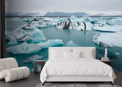 Aerial over icebergs floating in Jokulsarlon Lagoon by the southern coast of Iceland Wall mural