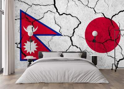 Flags of Nepal and Japan on cracked surface - politics, relationship concept Wall mural