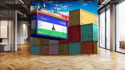 Freight shipping container with flag of Lesotho on crane hook - 3D illustration Wall mural