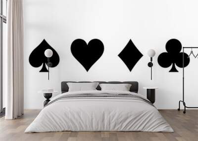 Poker card suits - hearts, clubs, spades and diamonds - on white background. Casino gambling theme vector illustration. Simple black silhouettes. Wall mural