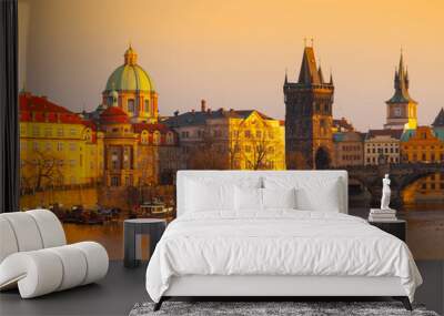 Prague Evening. Towers of Old Town and Charles Bridge over Vltava River illuminated by orange sunset. UNESCO World Heritage Site. Prague, capital city of Czech Republic, Europe Wall mural