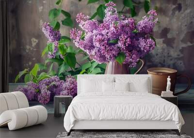 A charming bunch of purple lilacs an ancient book and a cup of coffee in a spring setup Wall mural