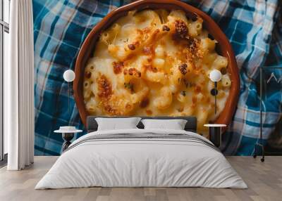 Brown dish of macaroni and cheese with a blue plaid tablecloth Wall mural