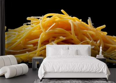 Spaghetti with cheddar cheese against a dark backdrop Wall mural