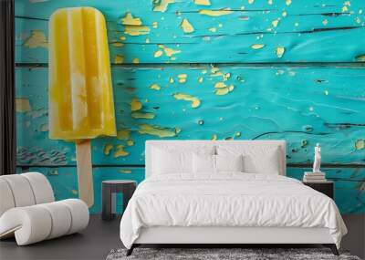 Top view of vegan yellow ice popsicle on aqua menthe wooden background copy space Wall mural