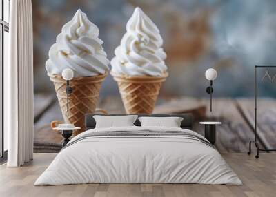 Two vanilla ice cream cones with swirls arranged on a wooden board Wall mural