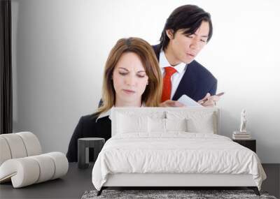 asian man looking over shoulder surfing copying caucasian woman Wall mural