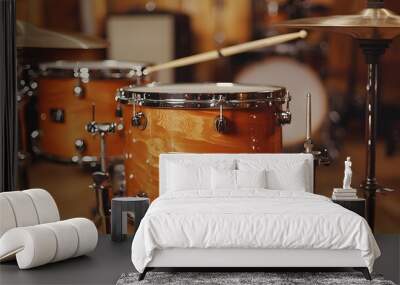 Close-up of a wooden drum kit in a warm, inviting studio setting. Wall mural