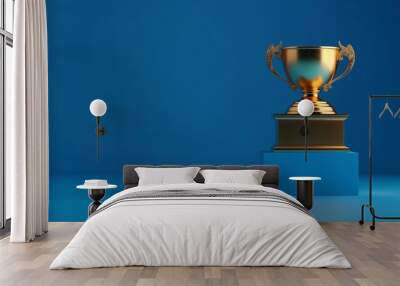 Gold cup trophy on blue table and blue wall background, concept of No.1, award, win, success, top one, copy space. Wall mural