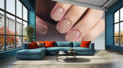 Woman hand with nude shades nail polish on her fingernails. Nude color nail manicure with gel polish at luxury beauty salon. Nail art and design. Female hand model. French manicure Ai generated Wall mural