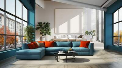 A bright and open modern living room with a large empty frame on the wall, a sleek white sofa, and multiple green indoor plants, creating a fresh and airy feel. Wall mural